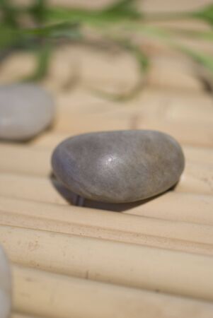 zen stones on bamboo background meditation conceptの写真素材