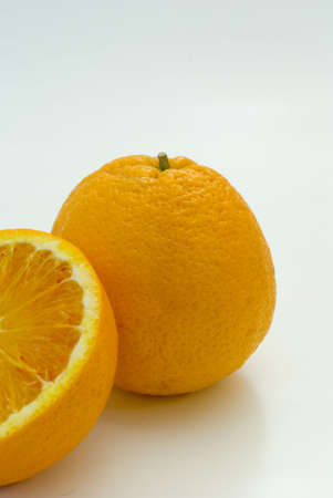 Fresh fruit, a tropical orange macro closeup, isolated on white