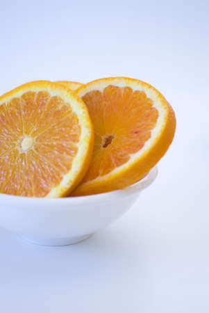 Fresh fruit, a tropical orange macro closeup, isolated on whiteの写真素材