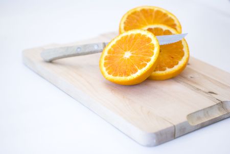 Fresh fruit, a tropical orange macro closeup, isolated on whiteの写真素材