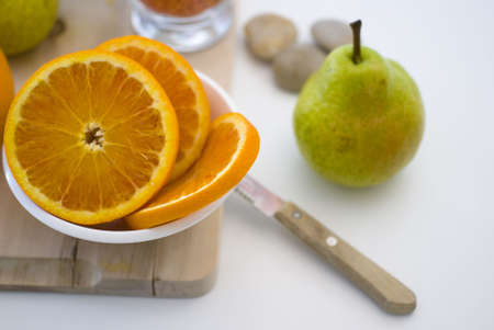 Fresh fruit, a tropical orange macro closeup, isolated on whiteの写真素材