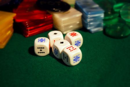Poker chips arranged on green feltの写真素材