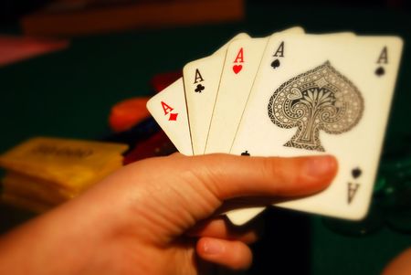 Cards and poker chips arranged on green feltのeditorial素材