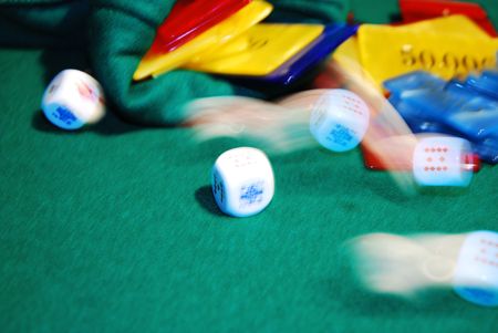 Poker chips arranged on green felt