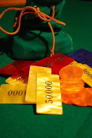 Poker chips arranged on green feltの写真素材