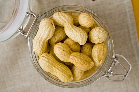 Peanut in a old glass jarの写真素材