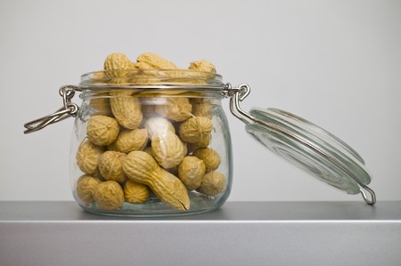 Peanut in a old glass jarの写真素材