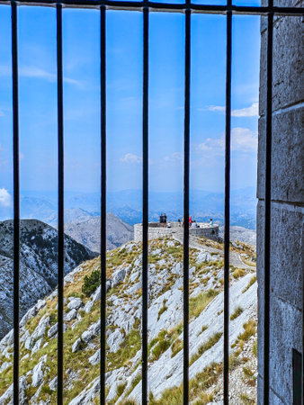 Mountain view through the lattice of an old fortress in Montenegroの写真素材