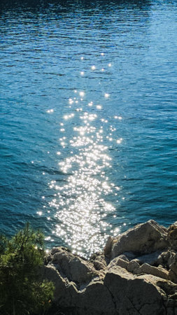 Sunbeams on the water in the sea. Summer background.の写真素材