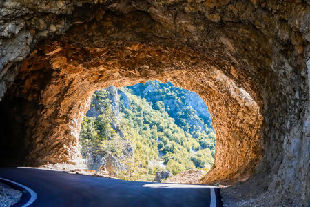 Mountain tunnel road through rockの写真素材