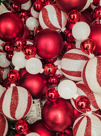 Close-Up of Red and Red-and-White Christmas Ornaments in Various Sizes