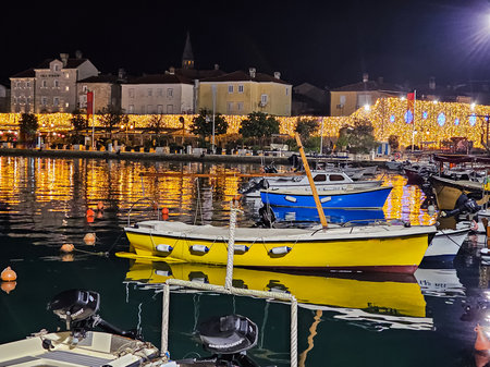 Budva Marina at Evening with Boats and Festive Lights of Old Townの写真素材