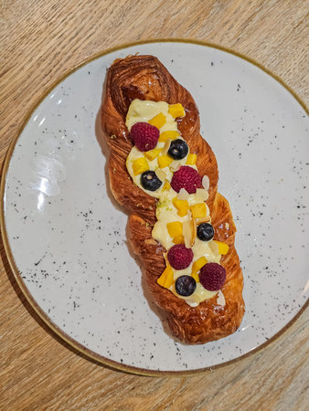 Top View of Woven Tart with Raspberries and Blueberries on Plateの写真素材