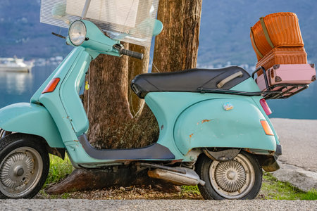 Blue Motorcycle Parked Near Tree Outdoors