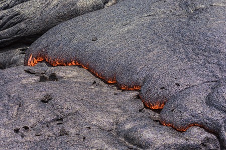 Lava flowing near Puuoo Crater Volcanoes National Park Big Island Hawaiiの写真素材