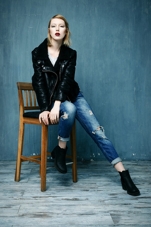 Beautiful woman in a leather jacket with bright makeupの写真素材