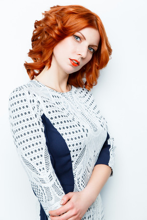 Pretty Woman with red curly hair wearing dressの写真素材