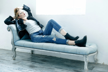 Beautiful woman in a leather jacket with bright makeupの写真素材