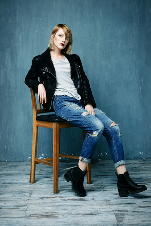 Beautiful woman in a leather jacket with bright makeupの写真素材