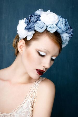 Beautiful woman with wreath on her head with bright makeupの写真素材