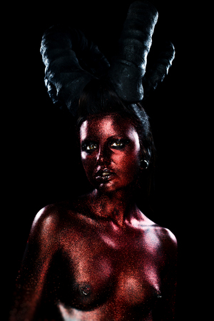 Portrait of beautiful and scary devil womanの写真素材