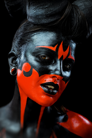 Portrait of beautiful and scary devil womanの写真素材
