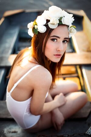 Sensual sexy woman wearing floral wreath and white lingerieの写真素材