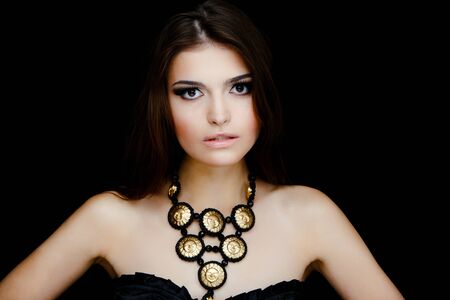 Sexy woman face with earrings and necklaceの写真素材