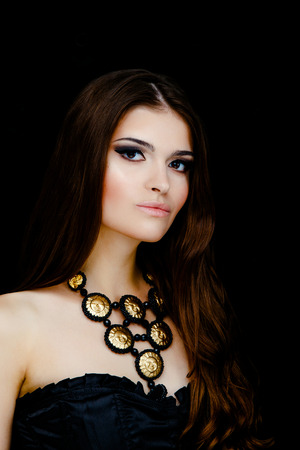 Sexy woman face with earrings and necklaceの写真素材