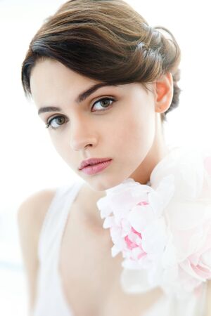 Beauty young beautiful woman face with floral necklaceの写真素材
