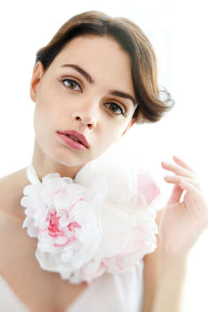 Beauty young beautiful woman face with floral necklaceの写真素材