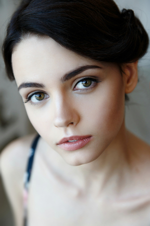 Pretty brunette woman face with natural make upの写真素材