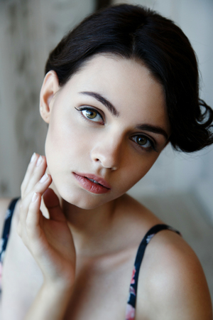 Pretty brunette woman face with natural make upの写真素材