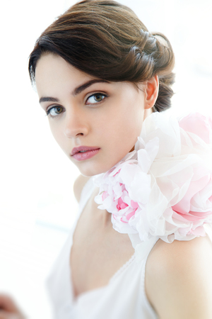 Beauty young beautiful woman face with floral necklaceの写真素材