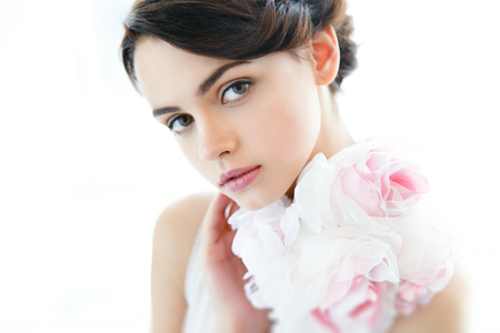 Beauty young beautiful woman face with floral necklaceの写真素材