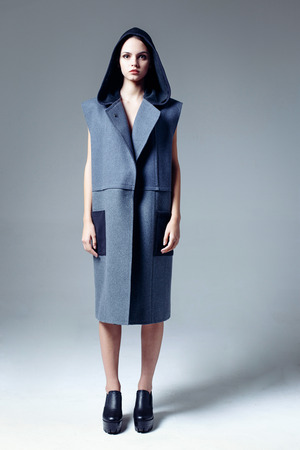 Beautiful young woman dressed in a coatの写真素材