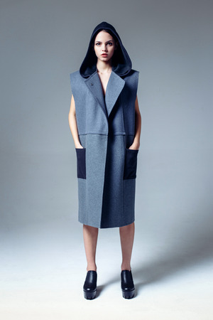 Beautiful young woman dressed in a coatの写真素材