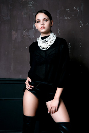 Pretty Woman wearing elegant trendy fashion clothes and white necklaceの写真素材