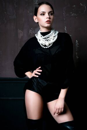 Pretty Woman wearing elegant trendy fashion clothes and white necklaceの写真素材