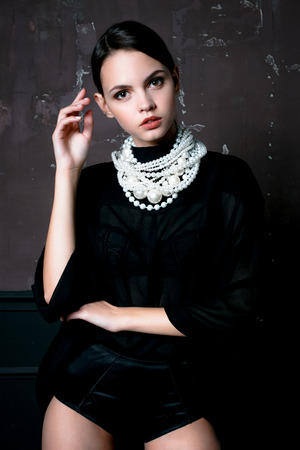 Pretty Woman wearing elegant trendy fashion clothes and white necklaceの写真素材