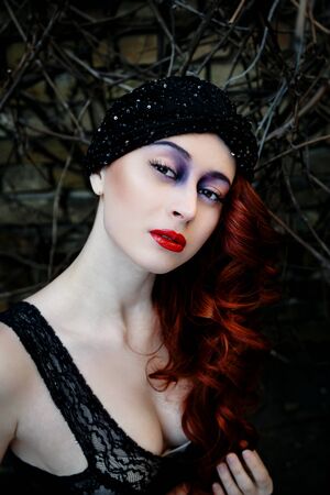 Beautiful redheaded woman face with bright make upの写真素材