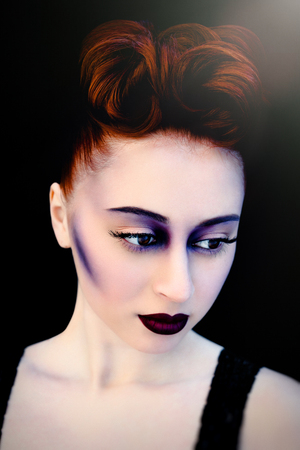 Beautiful redheaded woman face with bright make upの写真素材