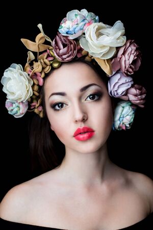 Portrait of a beautiful young woman in a wreath on hadの写真素材