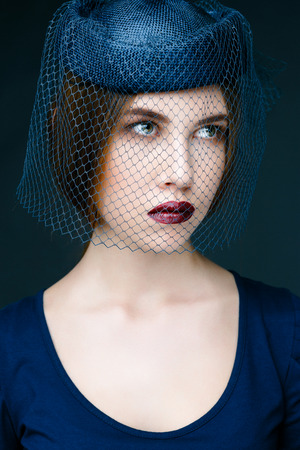 Beauty fashion girl. Portrait of beautiful young woman with fresh clean skin on grey backgroundの写真素材