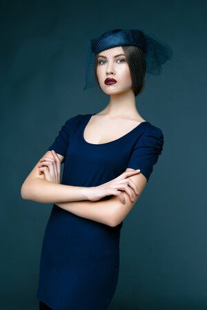 Pretty brunette woman with blue hat and mesh,の写真素材
