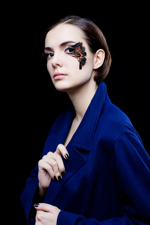 Portrait of pretty woman face with false feather eyelashes fashion makeupの写真素材