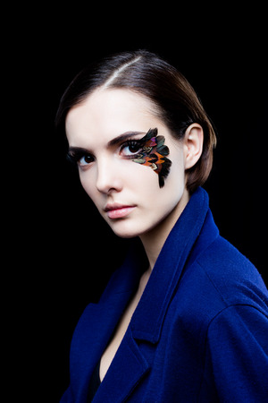 Portrait of pretty woman face with false feather eyelashes fashion makeupの写真素材