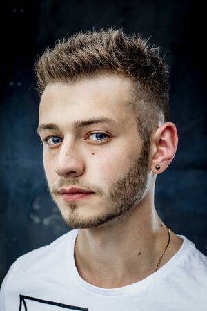 Elegant young handsome man. Studio fashion portrait.の写真素材