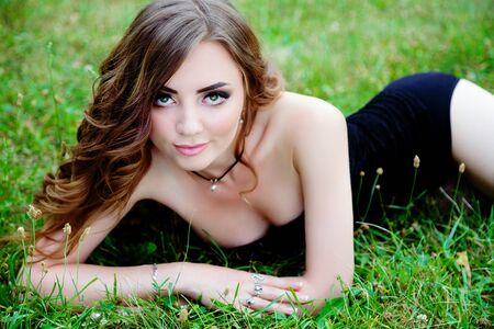 Beauty fashion girl. Portrait of beautiful young woman with fresh clean skin on glass wall backgroundの写真素材