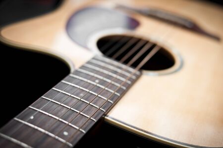 Close-up guitar body with sound hole and stringsの写真素材